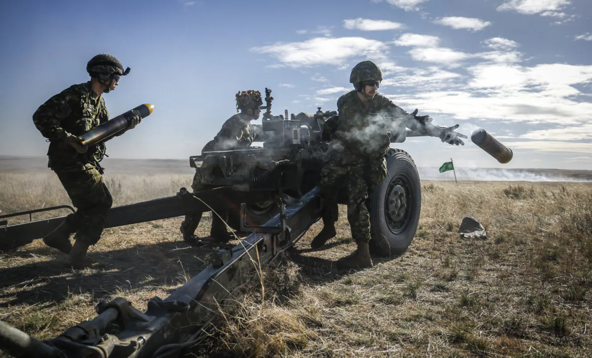 Soldiers of the 41 Canadian Brigade Group live fire a 105-mm howitzer during train at CFB Suffield, Alta., on Oct. 19, 2024. (The Canadian Press/Jeff McIntosh)