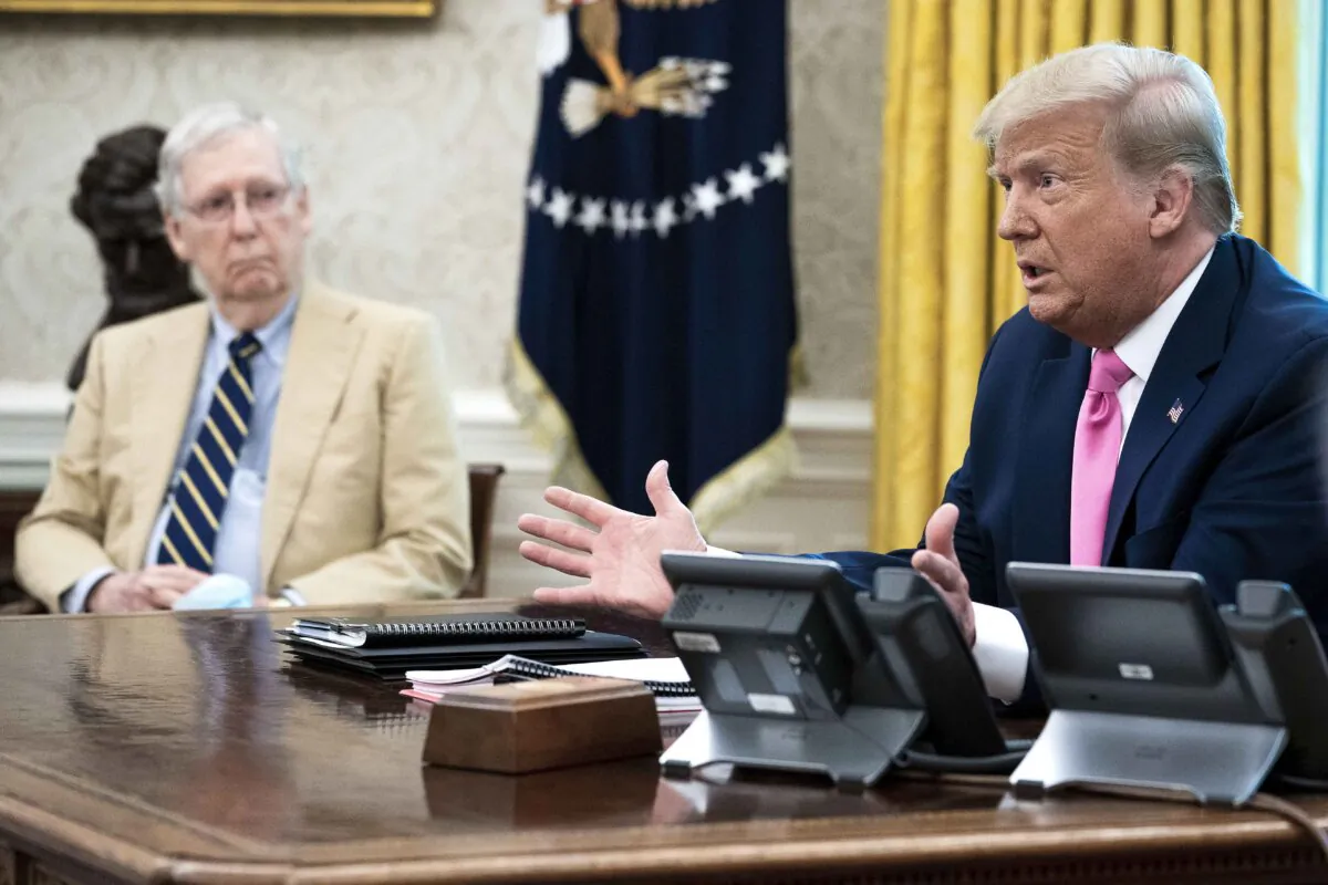 Senate Majority Leader Mitch McConnell (R-Ky.) (L) listens to President Donald Trump talks to reporters while hosting Republican congressional leaders and members of Trump's cabinet in the Oval Office at the White House on July 20, 2020. (Doug Mills/Pool via Getty Images)