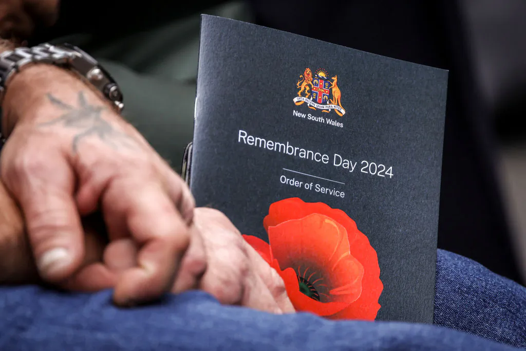 A veteran holds an offical booklet for the Remembrance Day Service to mark the anniversary of the end of World War I, at Martin Place in Sydney, Australia, on Nov. 11, 2024. (DAVID GRAY/AFP via Getty Images)
