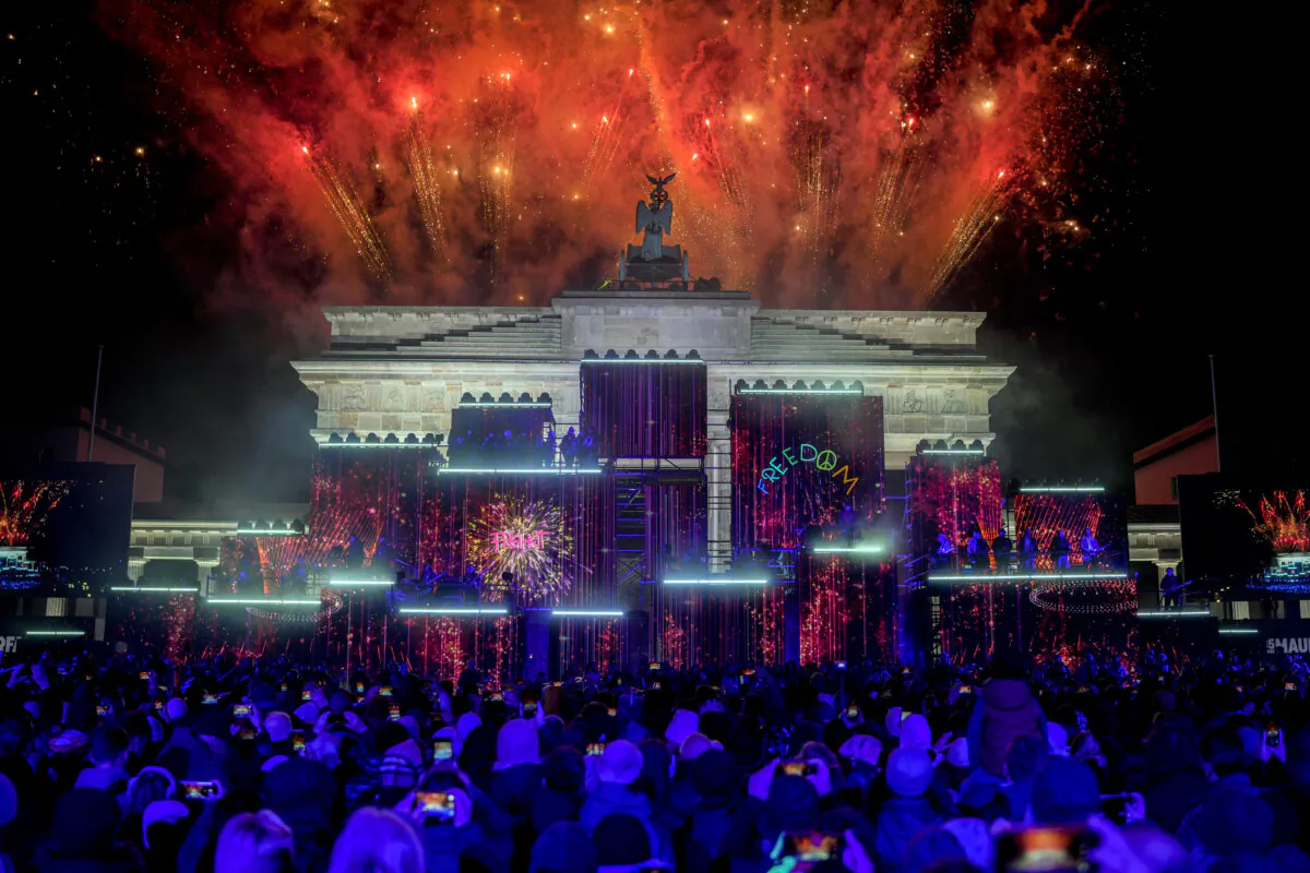 Fireworks light the sky during the as musicians play on stage during the concert for freedom for the 35th anniversary of the fall of the Berlin Wall, in Berlin, Germany, on Nov. 9, 2024. (Ebrahim Noroozi/AP Photo)