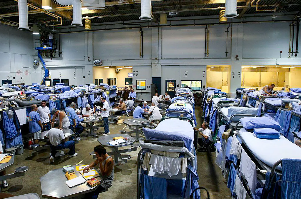 Inmates at the Mule Creek State Prison interact in a gymnasium that was modified to house prisoners, in Ione, Calif., on Aug. 28, 2007. (Justin Sullivan/Getty Images)