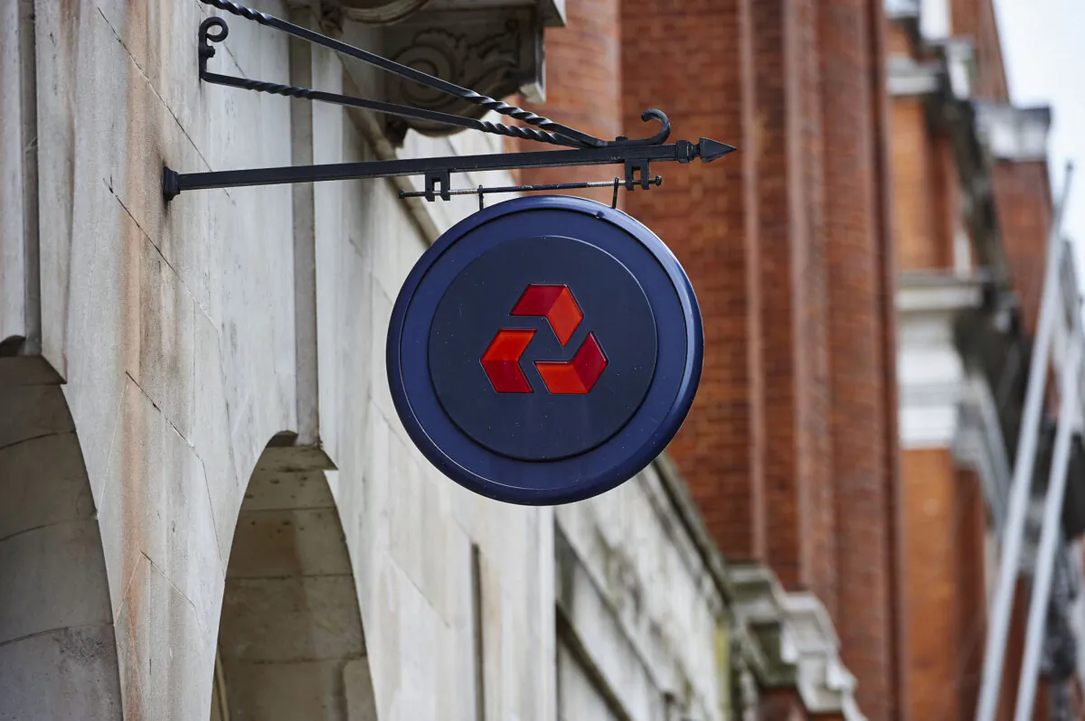 The NatWest logo hangs from the facade of a NatWest bank branch in central London, on July 17, 2015. (Niklas Halle’n/AFP via Getty Images)
