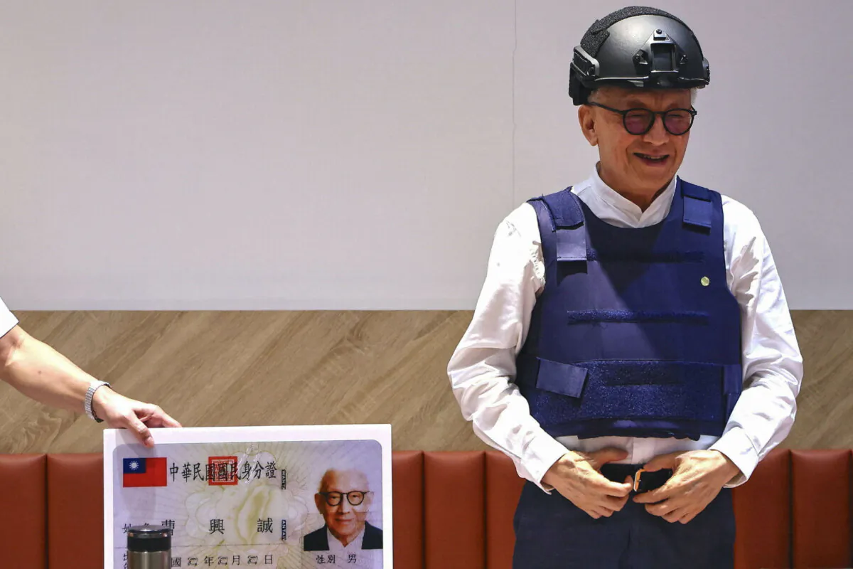 Robert Tsao, the former chairman of contract microchip maker UMC, poses for photos at a news conference where he announces his plans to fund civil defense education, in Taipei, Taiwan, on Sept. 1, 2022. (Ann Wang/Reuters)