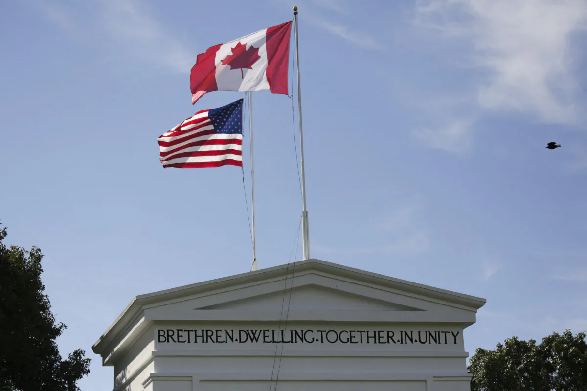 Canadian and American flags fly at the Peace Arch at the Canada–U.S. border in Blaine, Wash., on Aug. 9, 2021. (Jason Redmond/AFP via Getty Images)