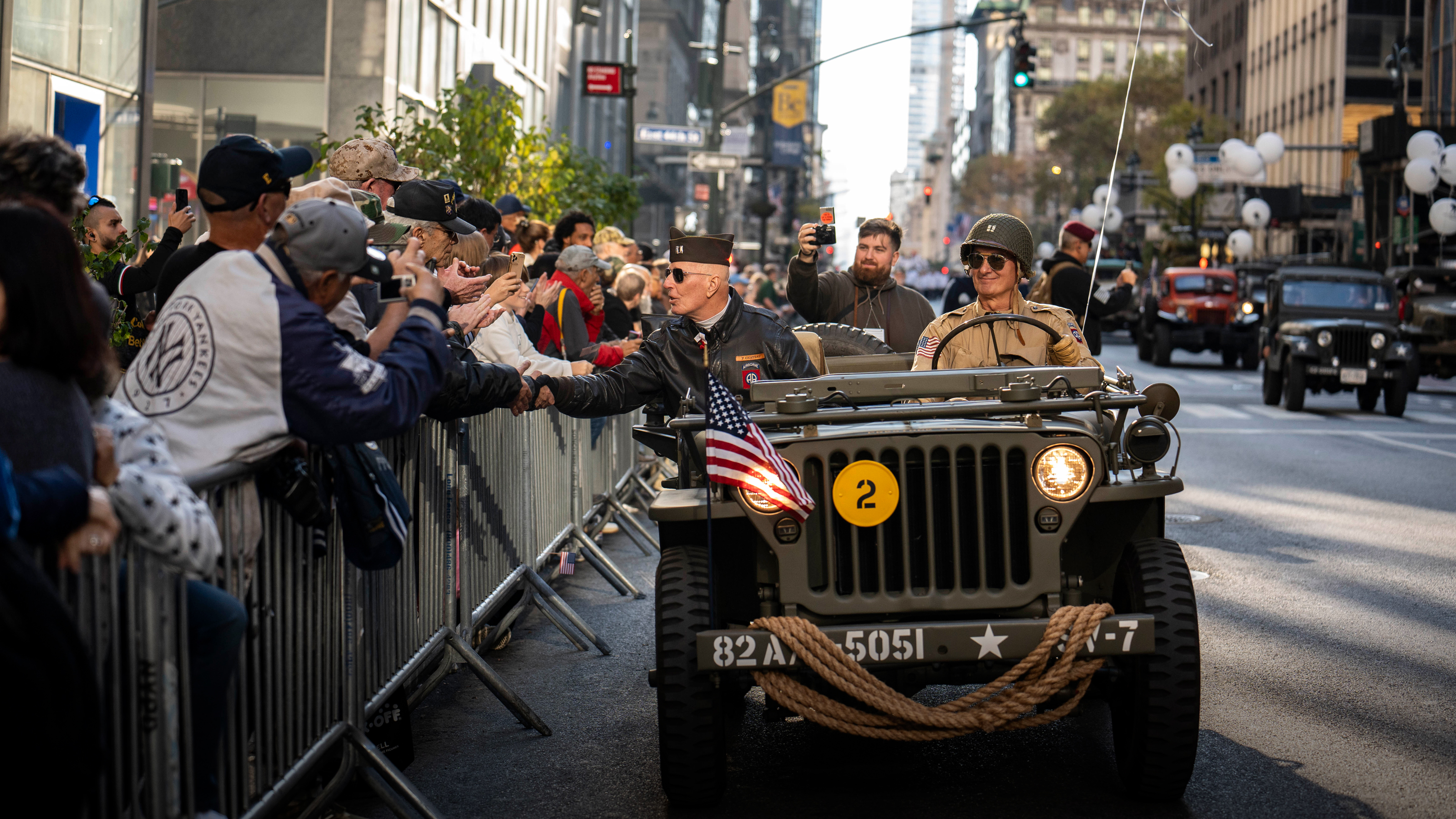 Day in Photos: Veterans Day Parade, COP29 Opening, and a Bathing Baby Hippo