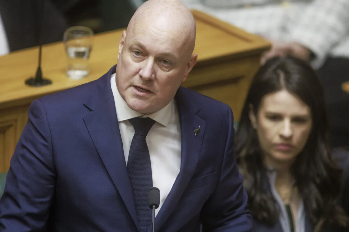 New Zealand's Prime Minister Christopher Luxon makes a "formal and unreserved" apology to abused children in care, in Parliament in Wellington, New Zealand on Nov. 12, 2024. (Robert Kitchin/Stuff via AP)