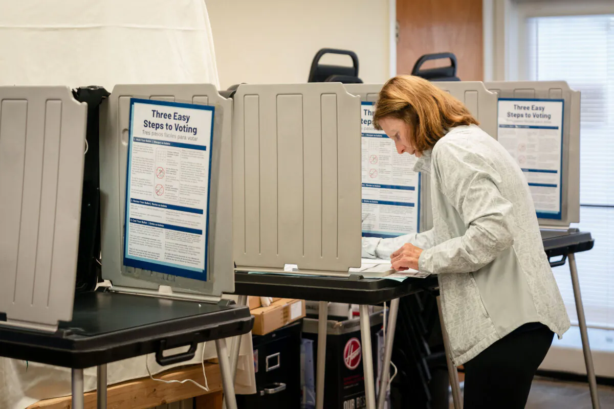 Voter Suzanne Murphy casts her ballot at a polling place inside the Sunset Ministry church in San Francisco on Nov. 5, 2024. (Loren Elliott/Getty Images)