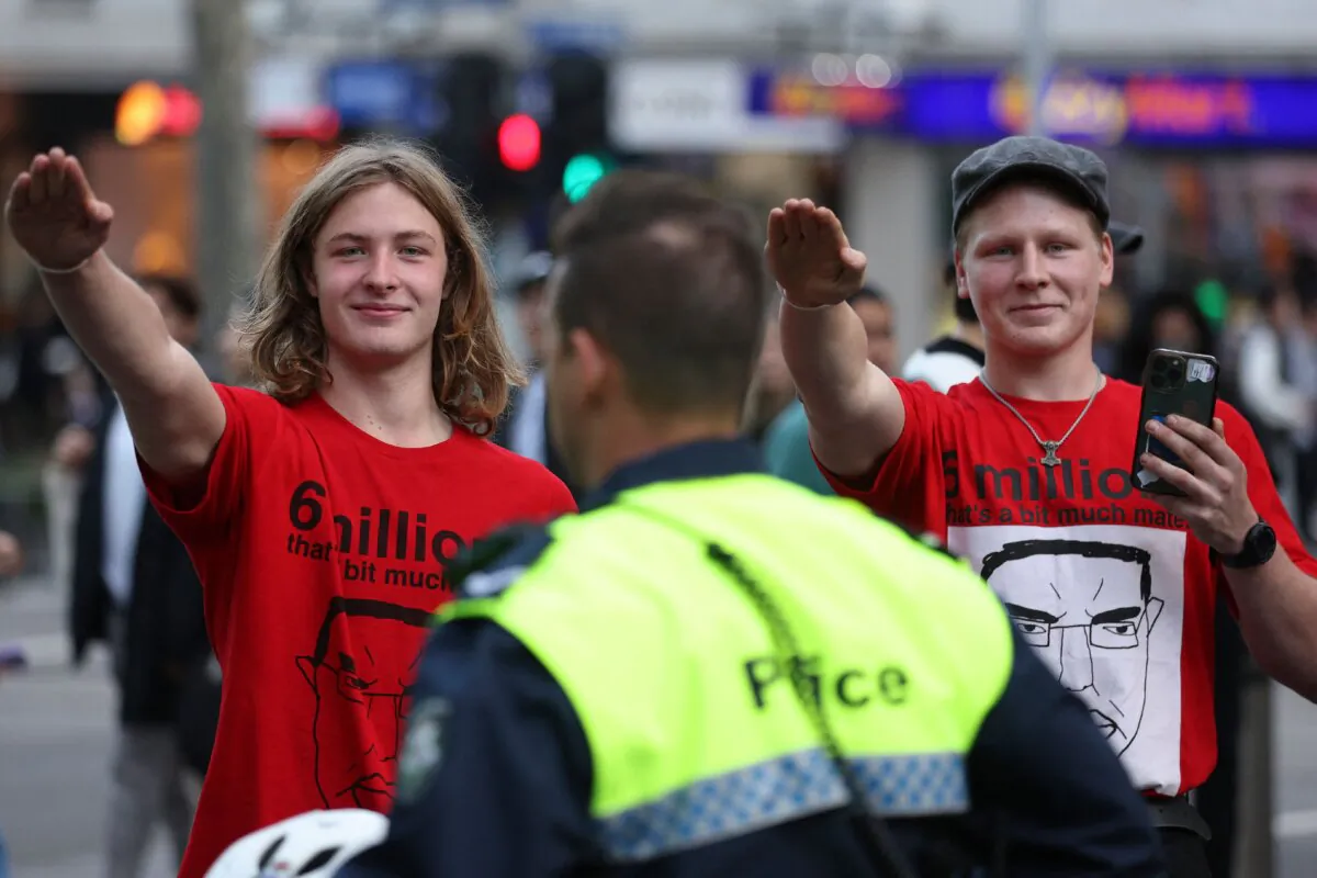 Members of the National Socialist Network perform Nazi salutes during a protest rally in Melbourne, Australia, on June 4, 2023. (MARTIN KEEP/AFP via Getty Images)