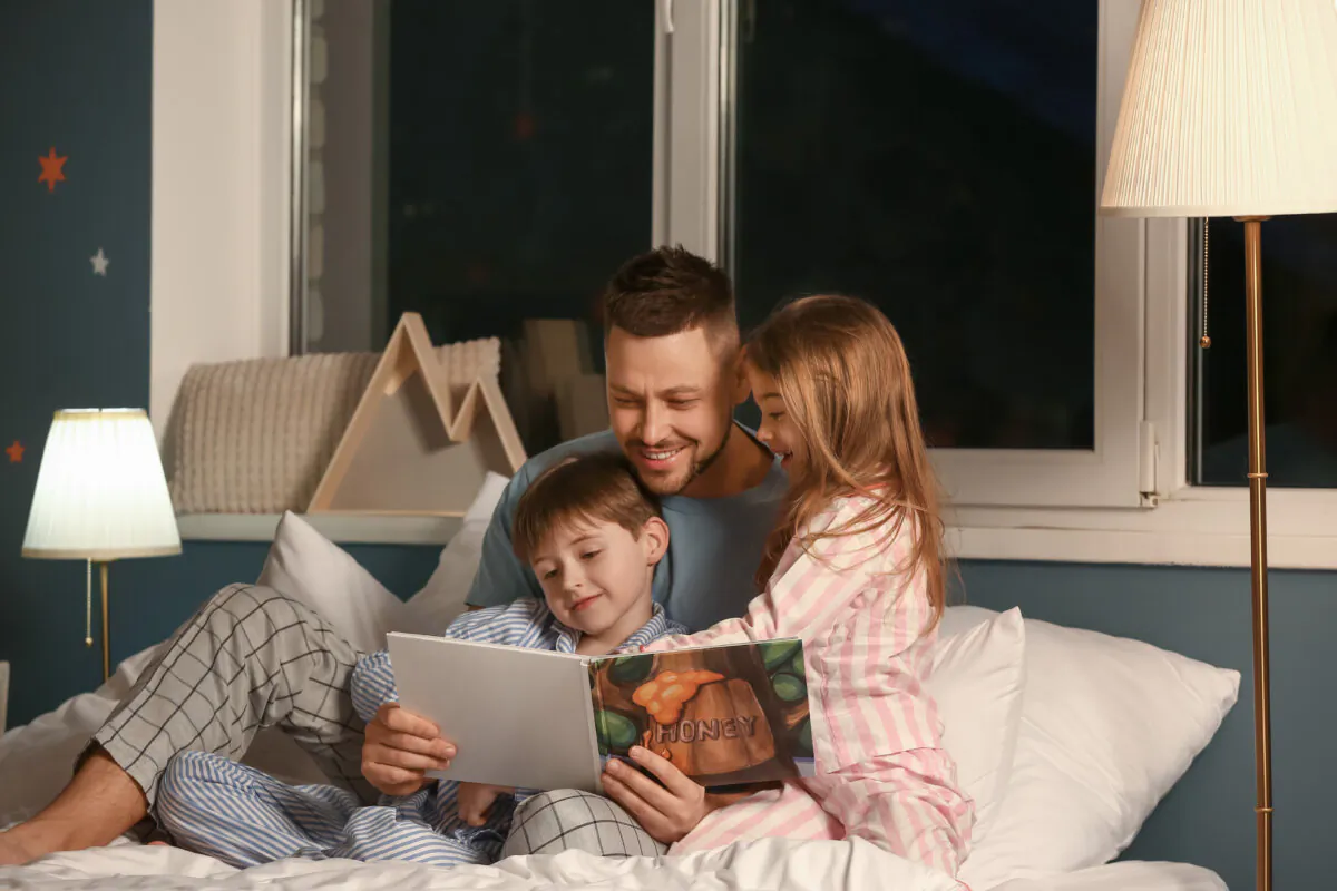 Reading aloud to your children is one of the most beneficial things you can do for them, and it’s a joyful experience that you’ll both treasure. (Pixel-Shot/Shutterstock)