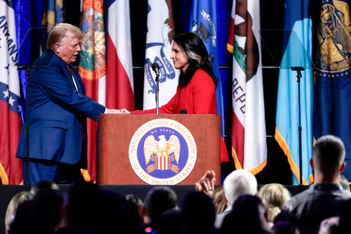 Former President Donald Trump (L) shakes hands with former Rep. Tulsi Gabbard after she endorsed him at the National Guard Association conference in Detroit on Aug. 26, 2024. (Jeff Kowalsky/AFP via Getty Images)