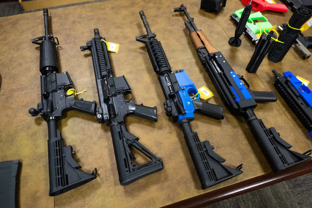 Semi-automatic and fully automatic firearms, including some that were modified using 3D printed parts, at the Bureau of Alcohol, Tobacco, Firearms and Explosives National Services Center in Martinsburg, West Virginia, Sept. 4, 2024. (Saul Loeb/AFP)
