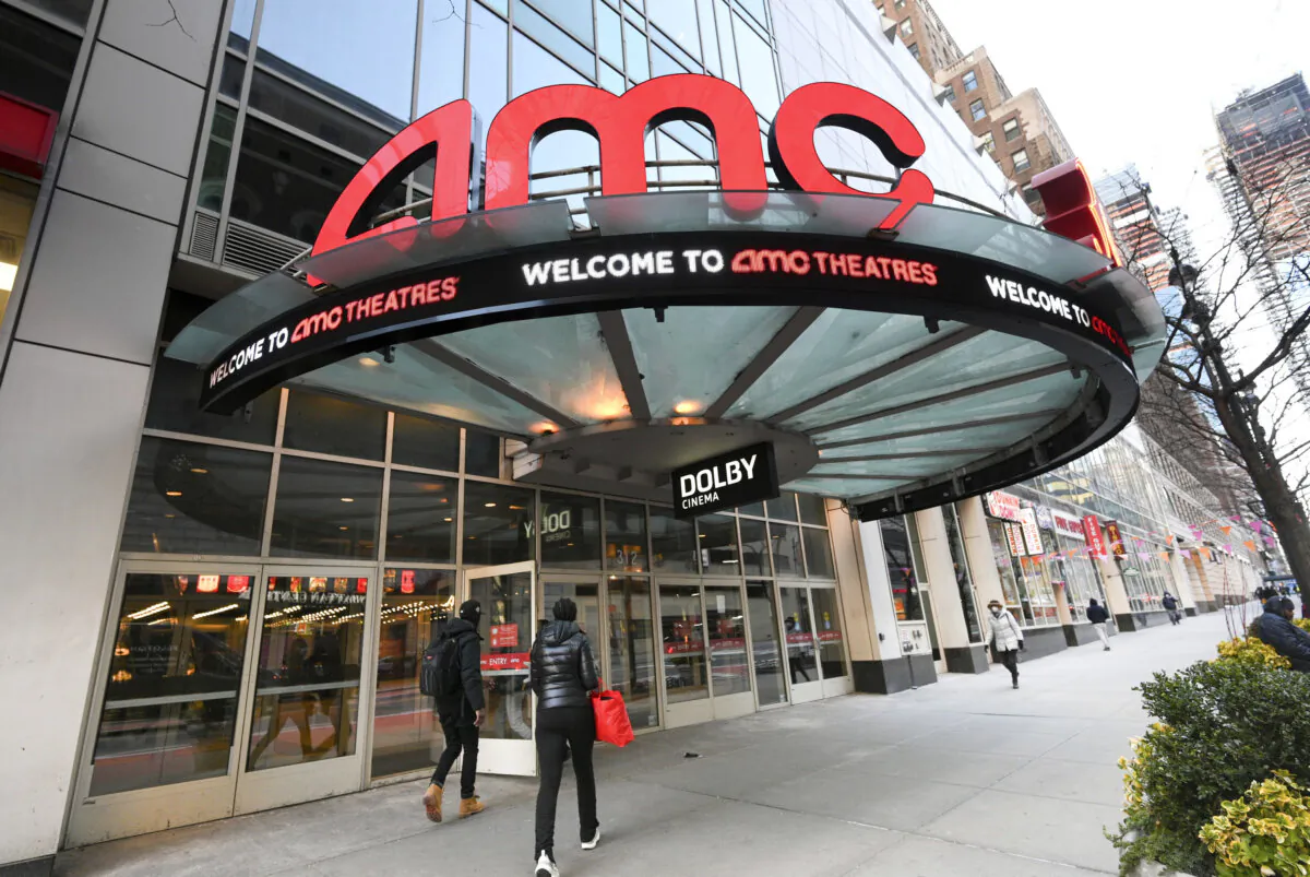 People walk by the AMC 34th Street theater in New York City on March 5, 2021. (Evan Agostini/Invision/AP)