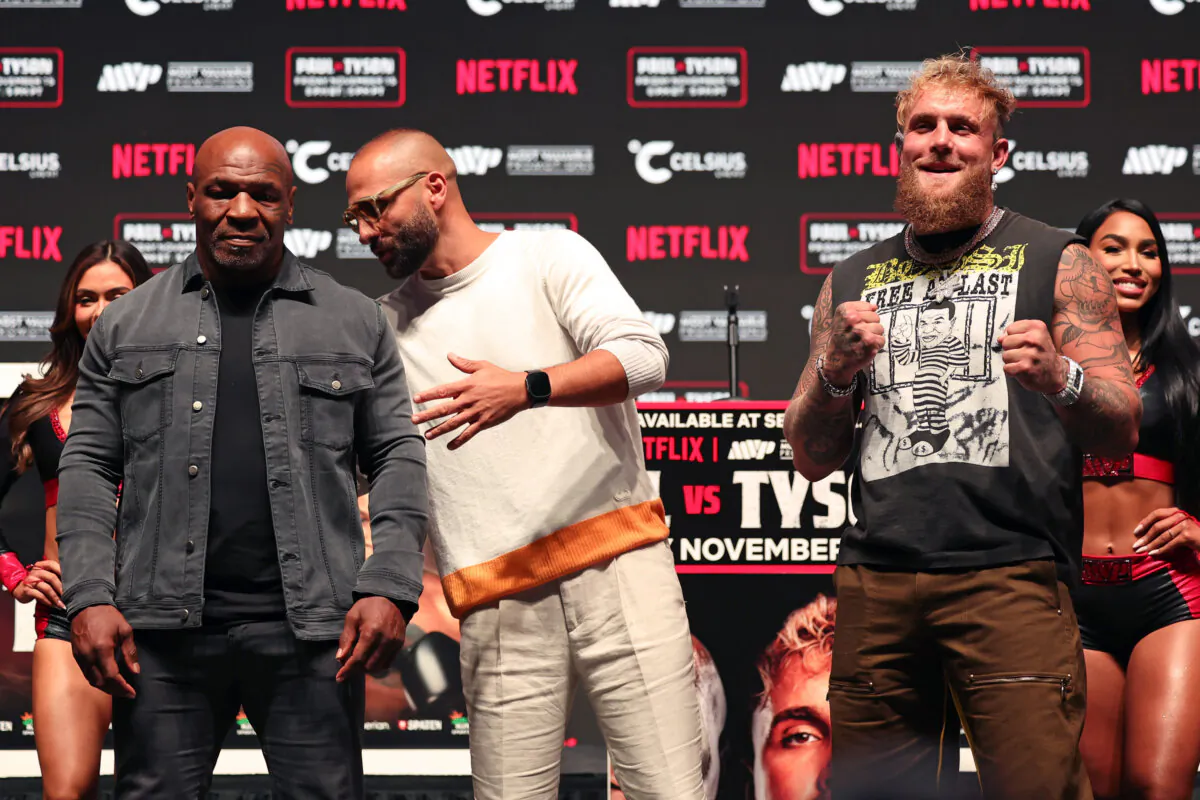 (L-R) Mike Tyson, Nakisa Bidarian, and Jake Paul attend the press conference for LIVE on Netflix: Jake Paul vs. Mike Tyson at the Toyota Music Factory in Dallas, Texas, on Nov. 13, 2024. (Brett Carlsen/Getty Images for Netflix © 2024)