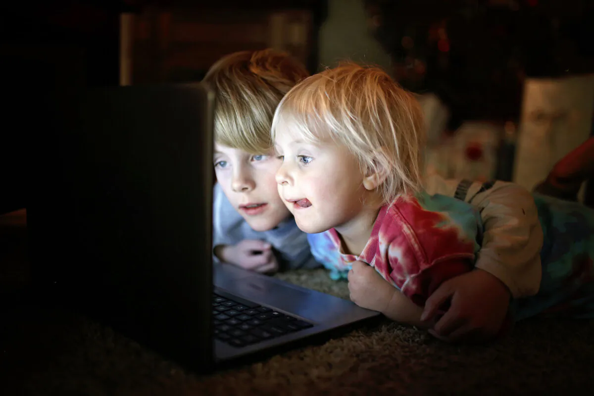 Parents need to exercise good communication with their kids to build trust and safe internet habits. (Christin Lola/Shutterstock)