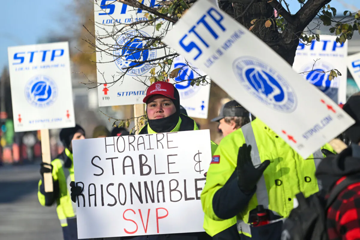 Canada Post workers picket outside a sorting plant in Montreal on Friday, Nov. 15, 2024. (Graham Hughes /The Canadian Press via AP)