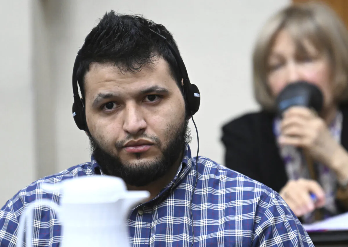 Jose Ibarra, accused of killing Georgia nursing student Laken Riley earlier this year, listens through an interpreter during his trial at Athens-Clarke County Superior Court in Athens, Ga., on Nov. 15, 2024. (Hyosub Shin/Atlanta Journal-Constitution via AP, Pool)