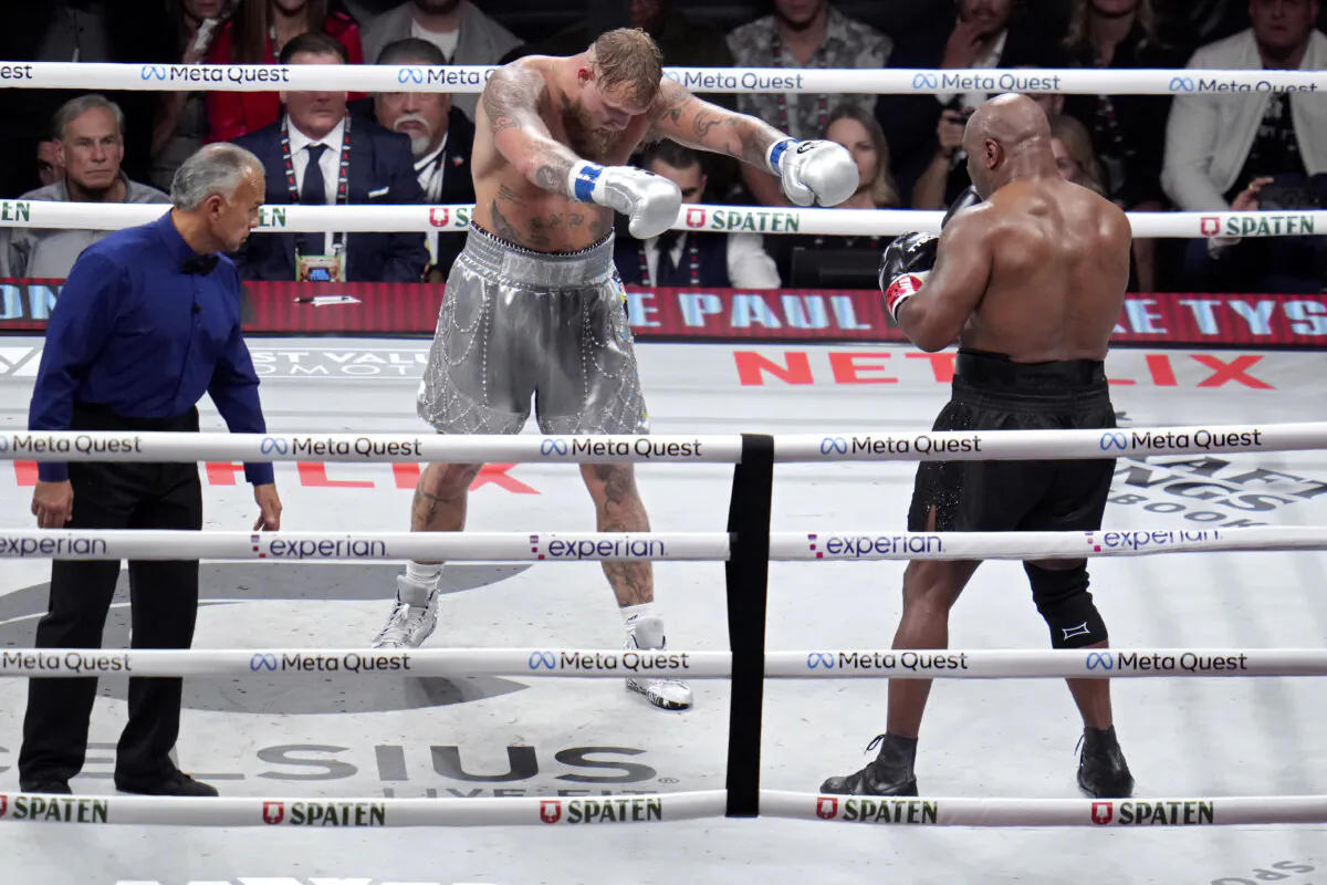 Jake Paul (L) motions towards Mike Tyson during their heavyweight boxing match in Arlington, Texas, on Nov. 15, 2024. (Julio Cortez/AP Photo)