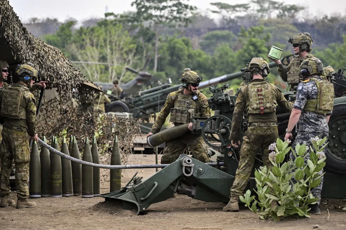 Australian Defence Force (ADF) soldiers prepare to fire a M777A2 during a joint training exercise in the Combined Arm Live Fire Exercise (Calfex) named Keris Woomera at the Marine Combat Training Center in Situbondo on Nov. 16, 2024. (JUNI KRISWANTO/AFP PHOTO/AFP via Getty Images)