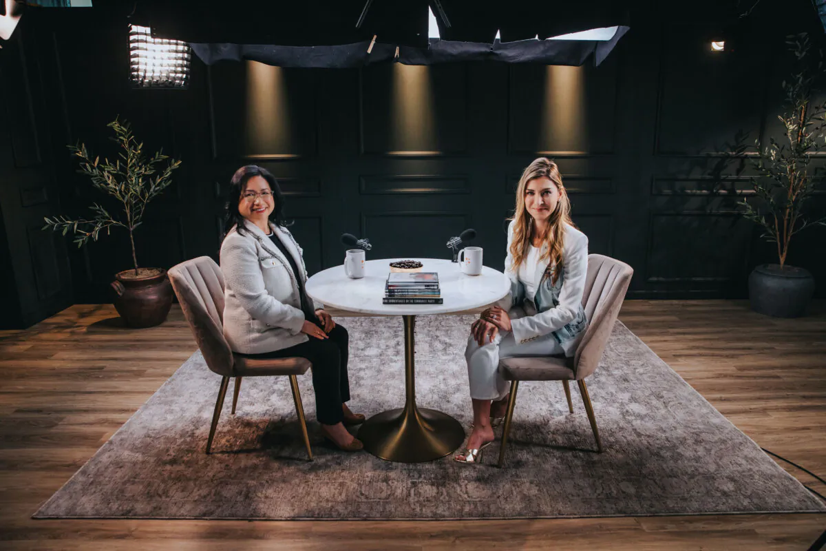 Epoch Times CEO Janice Trey and host of PragerU's Real Talk podcast Marissa Streit in a studio for an interview aired on Nov. 13, 2024. (Courtesy of PragerU)