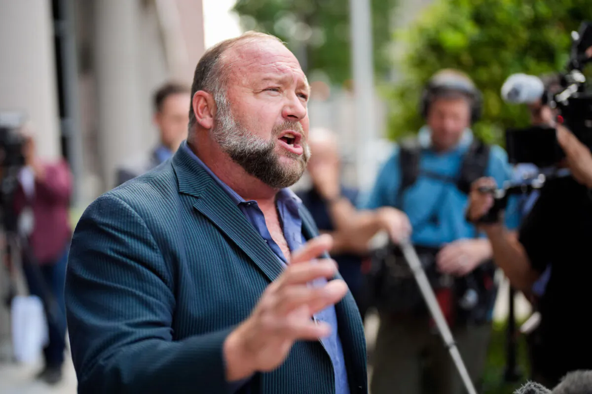 Alex Jones speaks to the media after arriving at the federal courthouse for a hearing in front of a bankruptcy judge, in Houston on June 14, 2024. (David J. Phillip/AP Photo)