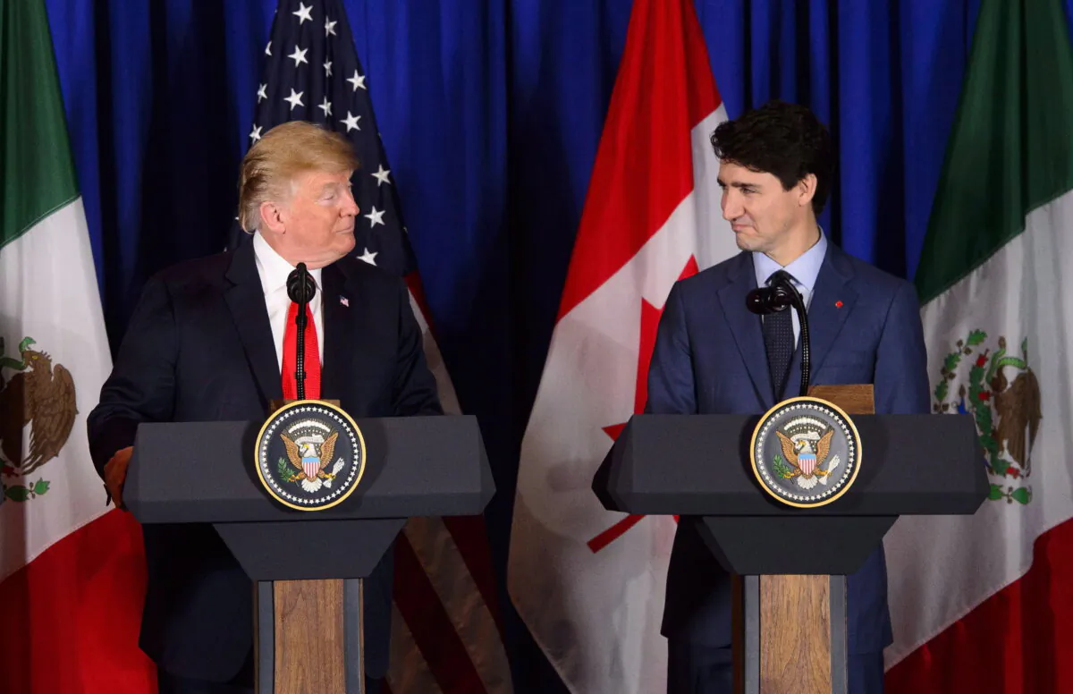 Prime Minister Justin Trudeau (R) and President of the United States Donald Trump participate in a signing ceremony for the new United States-Mexico-Canada Agreement with President of Mexico Enrique Pena Nieto (not shown) in Buenos Aires, Argentina, on Nov. 30, 2018. (The Canadian Press/Sean Kilpatrick)
