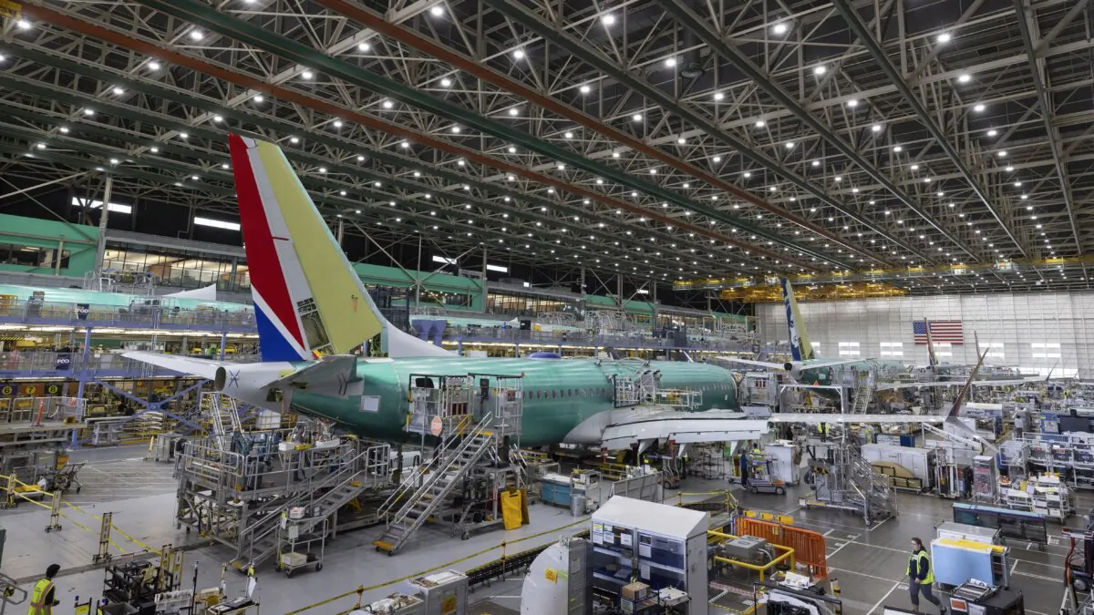 Boeing employees work on the 737 MAX on the final assembly line at Boeing's Renton plant in Renton, Wash., on June 15, 2022. (Ellen M. Banner/The Seattle Times via AP, Pool)