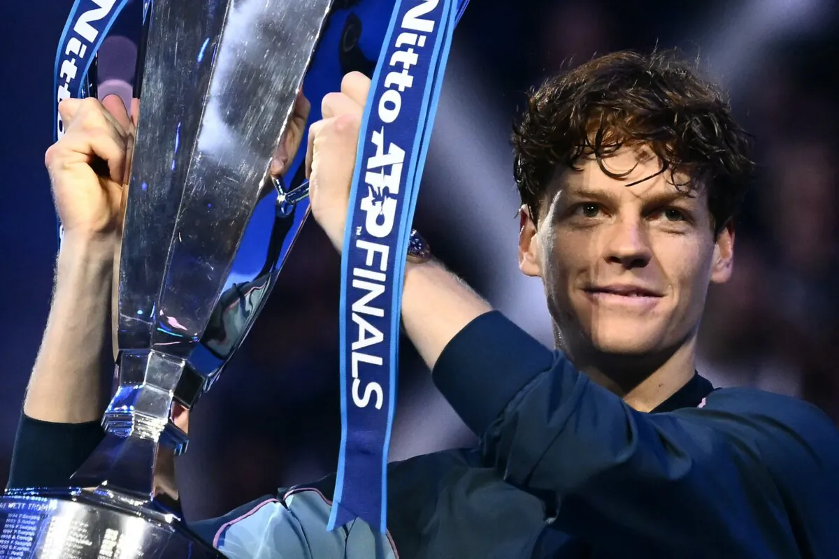 Italy's Jannik Sinner lifts the trophy after winning the final against USA's Taylor Fritz at the ATP Finals tennis tournament in Turin, on Nov. 17, 2024. (Marco Bertorello/AFP via Getty Images)