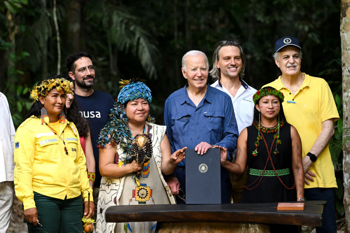 President Joe Biden signs a proclamation designating Nov. 17 as International Conservation Day during a tour of the Museu da Amazonia as he visits the Amazon Rainforest in Manaus, Brazil, on Nov. 17, 2024. (Saul Loeb/AFP via Getty Images)