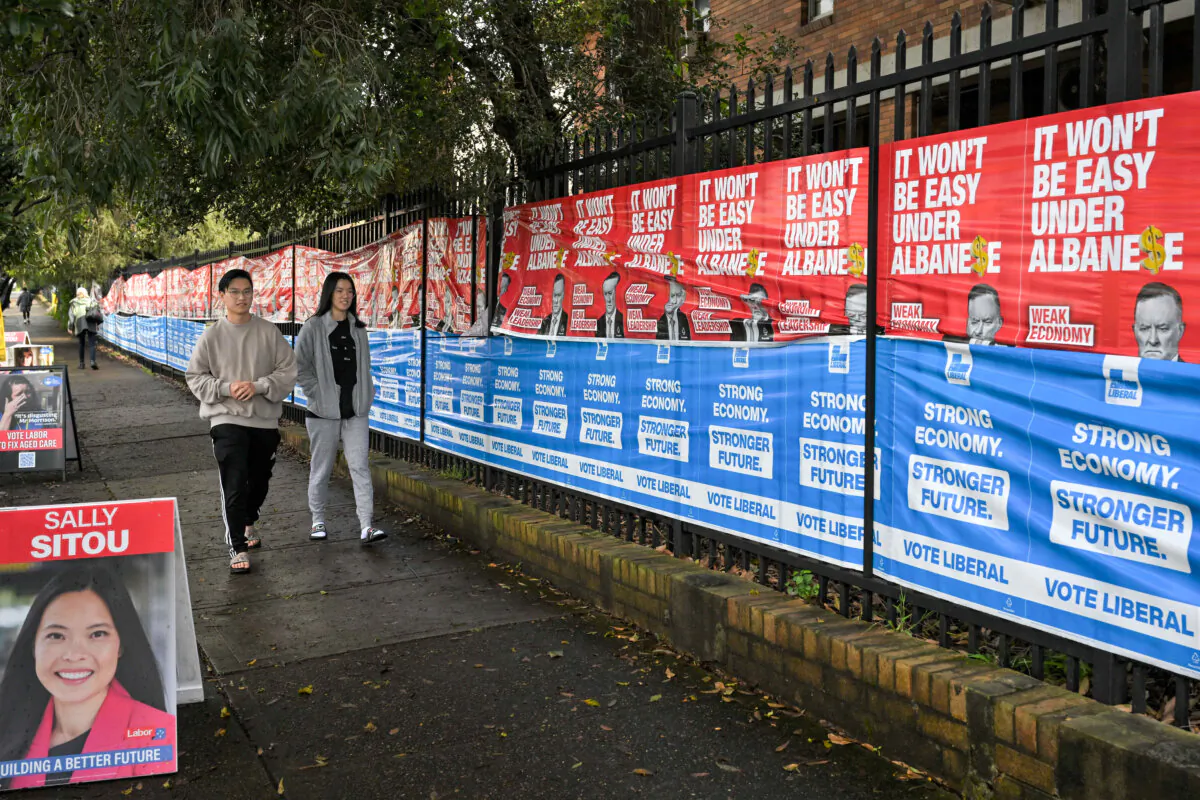 An abundance of Liberal Party signage at the Strathfield North Public School polling booth on Federal Election day, in the seat of Reid, in Sydney, Australia, on May 21, 2022. (AAP Image/Dean Lewins)