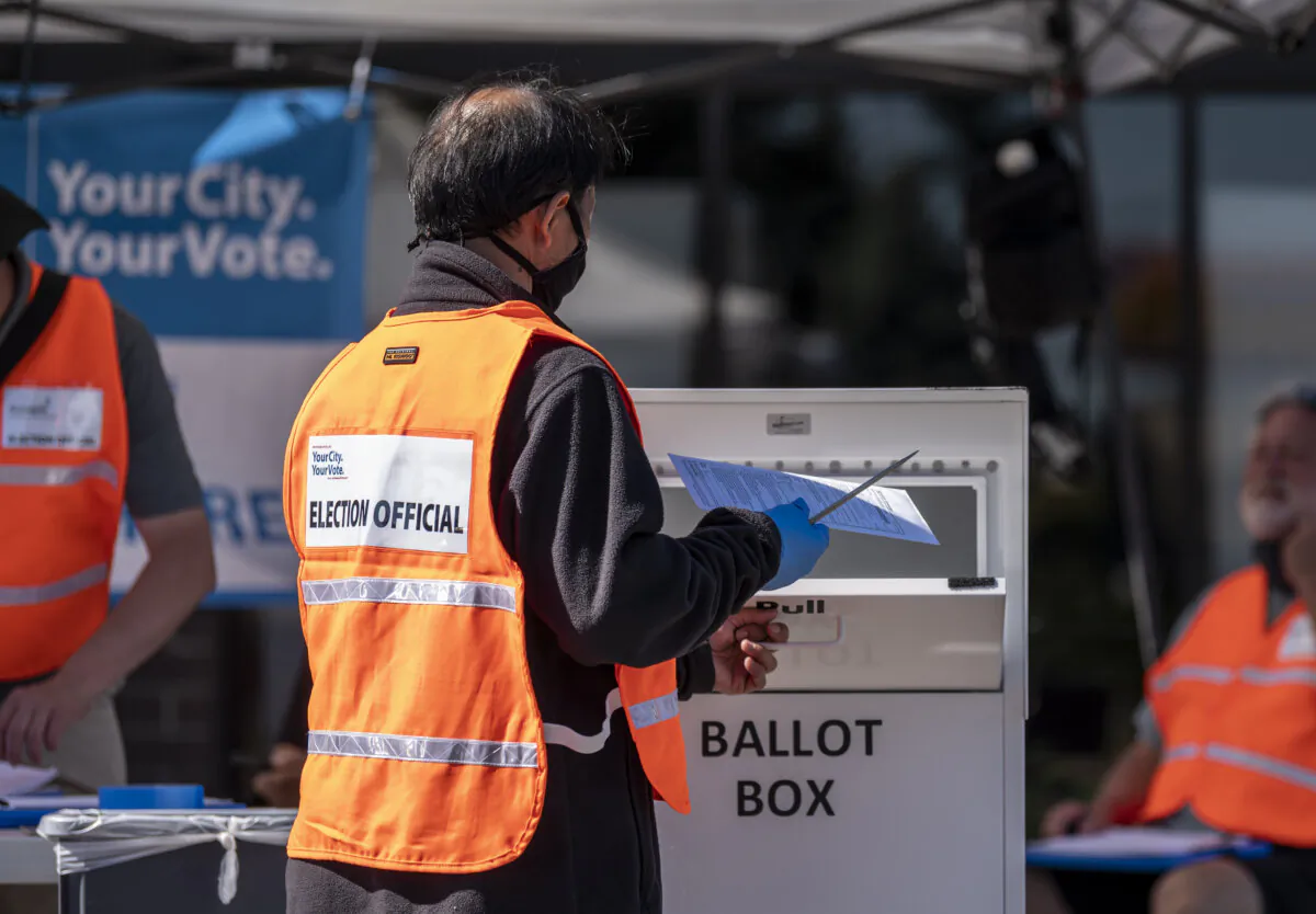 An election official checks ballots in Minnesota, in this file photograph. (Stephen Maturen/Getty Images)
