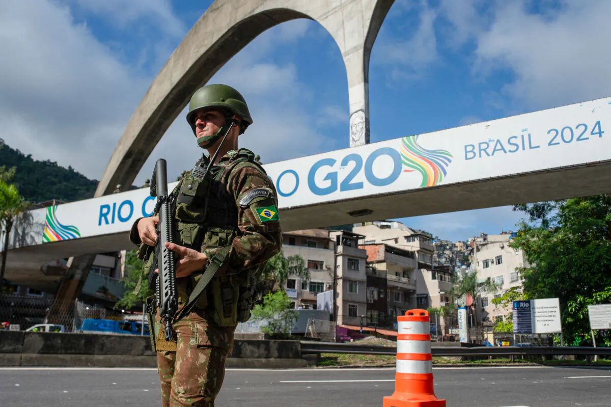 A Brazilian army soldier stands guard in front of the Rocinha slum in Rio de Janeiro as part of security measures for the G20 summit, on Nov. 17, 2024. (Tercio Teixeira/AFP via Getty Images)
