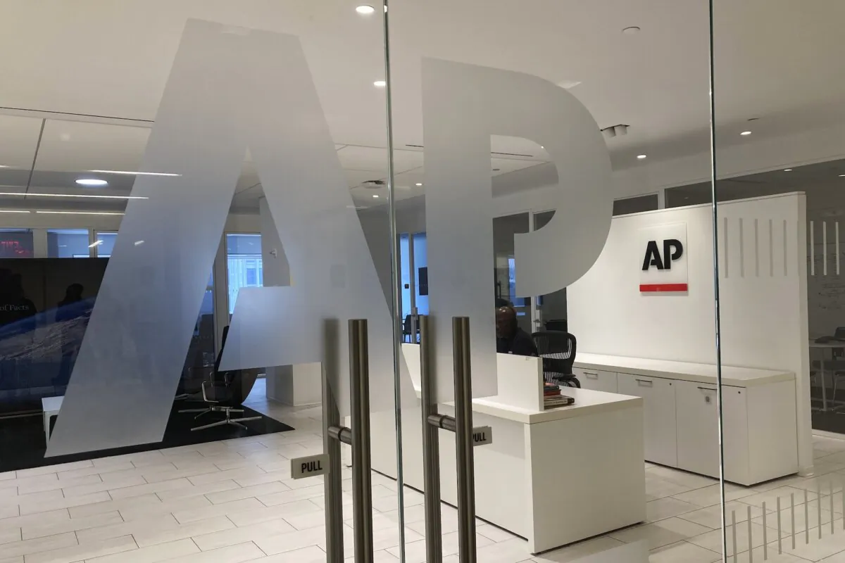 The Associated Press logo is shown at the entrance to the news organization's office in New York, on July 13, 2023. (Aaron Jackson/AP Photo)