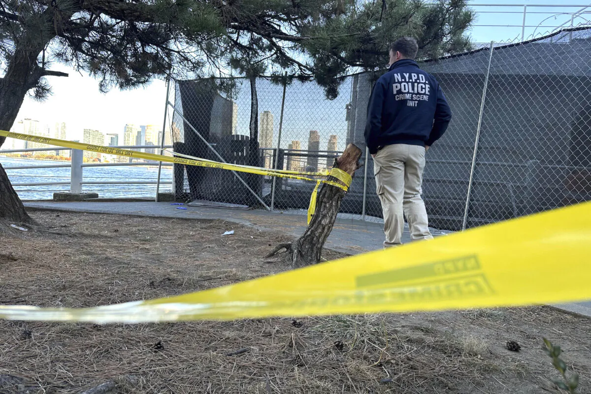 An NYPD officer works at the scene of a stabbing in New York on Nov. 18, 2024. (David R. Martin/AP Photo)