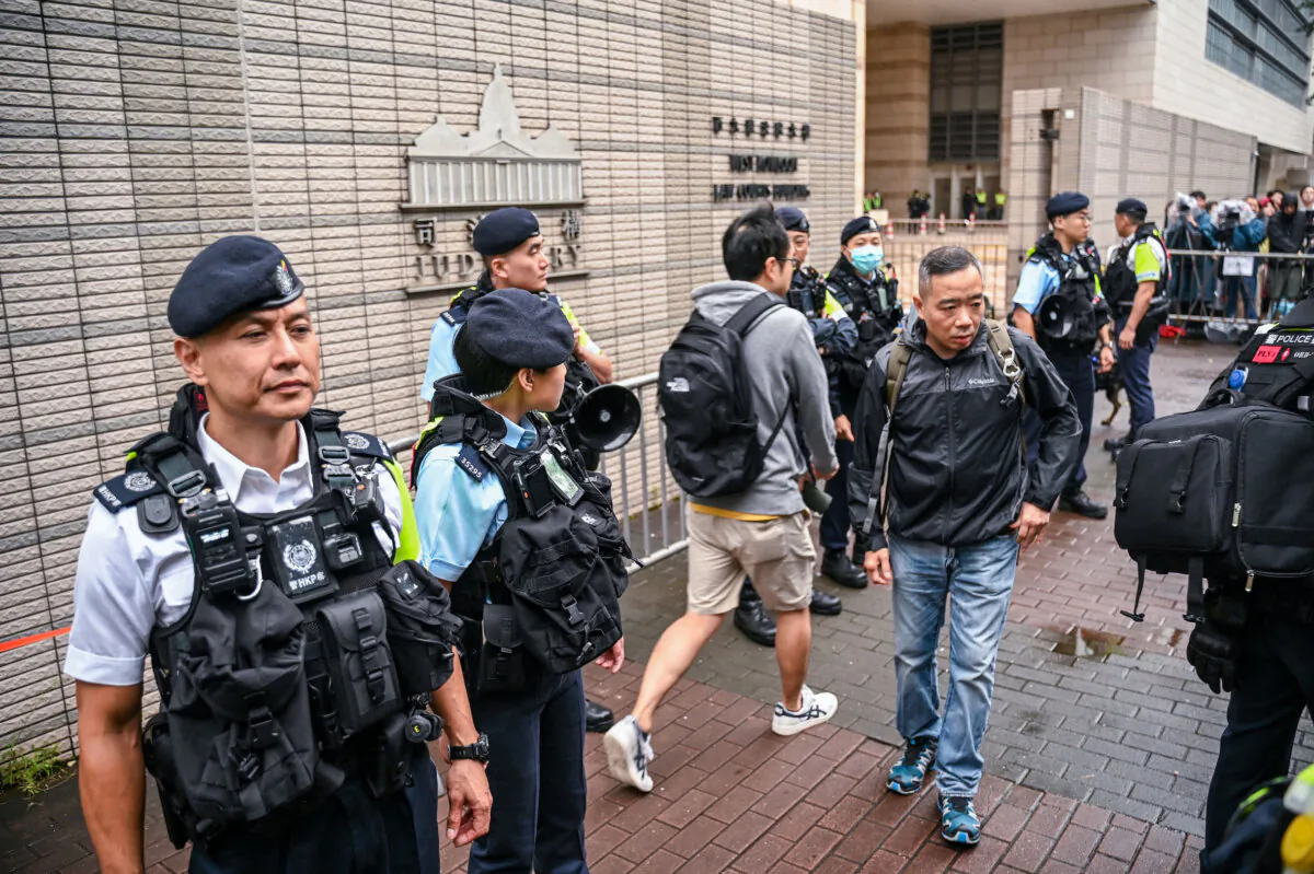 Police keep watch outside the West Kowloon Magistrates' Court in Hong Kong on Nov. 19, 2024. (Peter Parks/AFP via Getty Images)