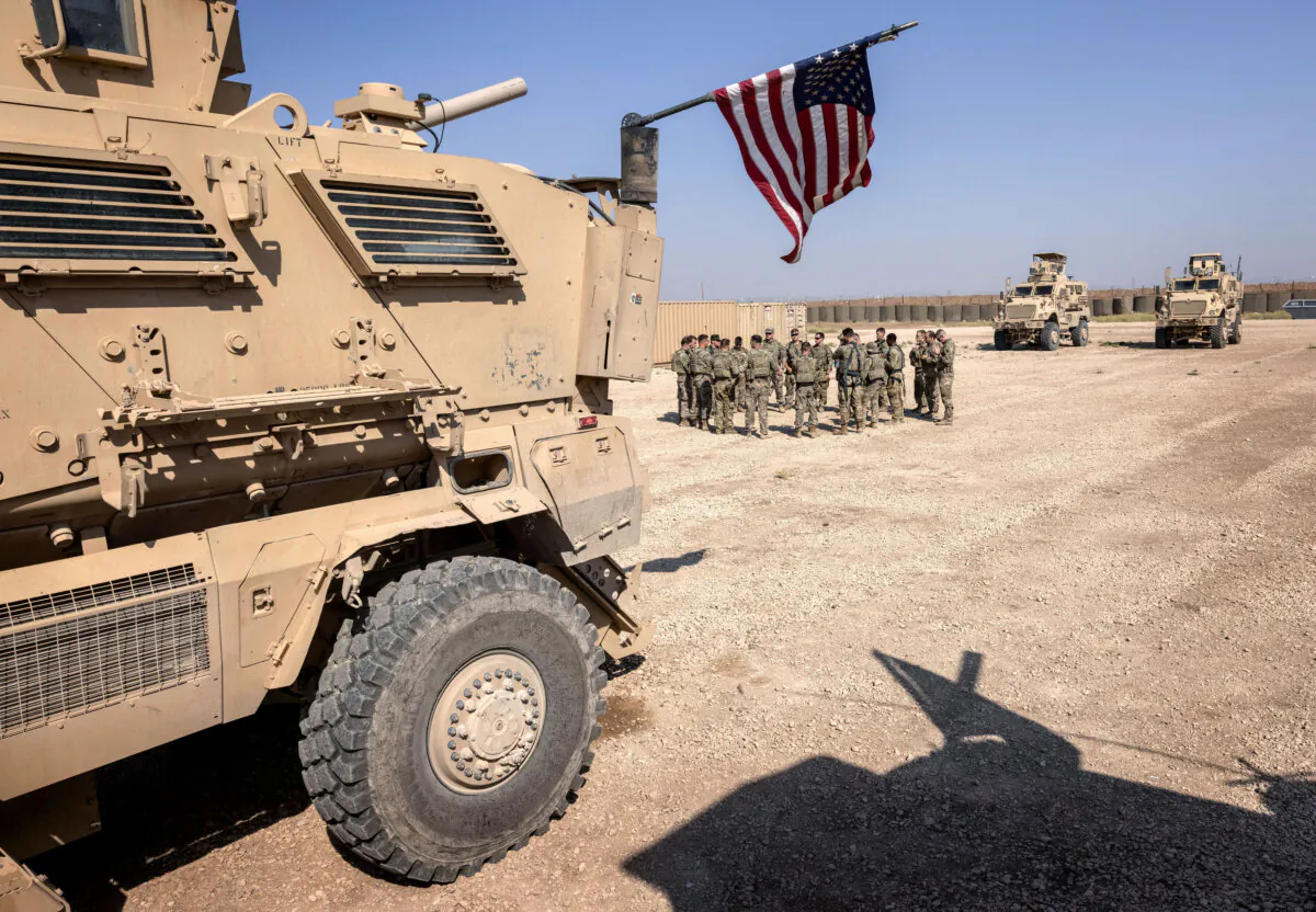 U.S. Army soldiers prepare to go on patrol from a remote combat outpost in northeastern Syria on May 25, 2021. (John Moore/Getty Images)