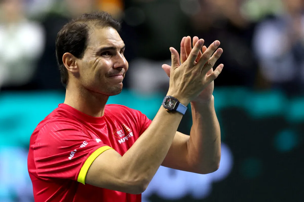 Spain's Rafael Nadal applauds during a tribute to his career at the end of the quarter-final doubles match between Netherlands and Spain during the Davis Cup Finals at the Palacio de Deportes Jose Maria Martin Carpena arena in Malaga, southern Spain, on Nov. 19, 2024. (Thomas Coex/AFP via Getty Images)