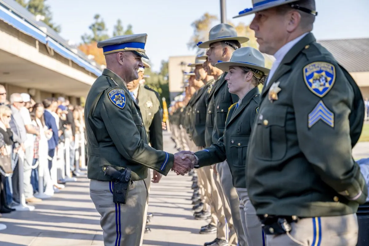 California Highway Patrol Commissioner Sean Duryee shakes hands with a new officer during a graduation ceremony in Sacramento, Calif., on Nov. 15, 2024. (California Highway Patrol)