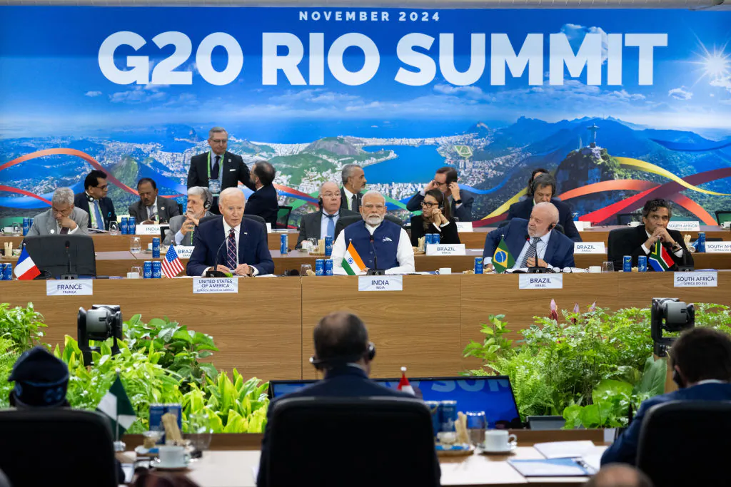 US President Joe Biden, alongside Indian Prime Minister Narendra Modi (C) and Brazilian President Luiz Inácio Lula da Silva (2nd R), speaks during the second day of the G20 Summit at the Museum of Modern Art in Rio De Janeiro, Brazil on Nov. 19, 2024. (Saul Loeb/Pool/AFP via Getty Images)