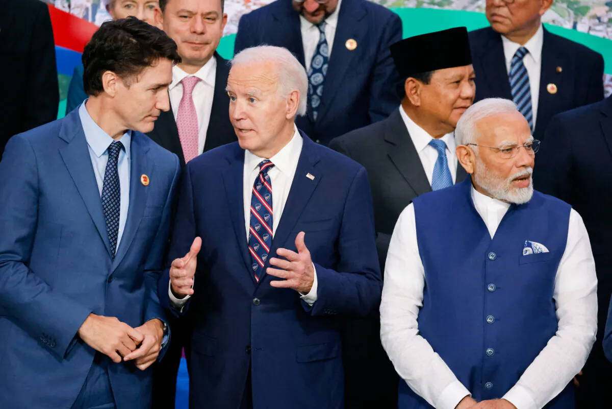 (L–R, front) Canadian Prime Minister Justin Trudeau, U.S. President Joe Biden, and Indian Prime Minister Narendra Modi and Indonesian President Prabowo Subianto (2nd R back) during a group photo at the G20 Leaders' Meeting in Rio de Janeiro on Nov. 19, 2024. (Ludovic Marin /AFP via Getty Images)