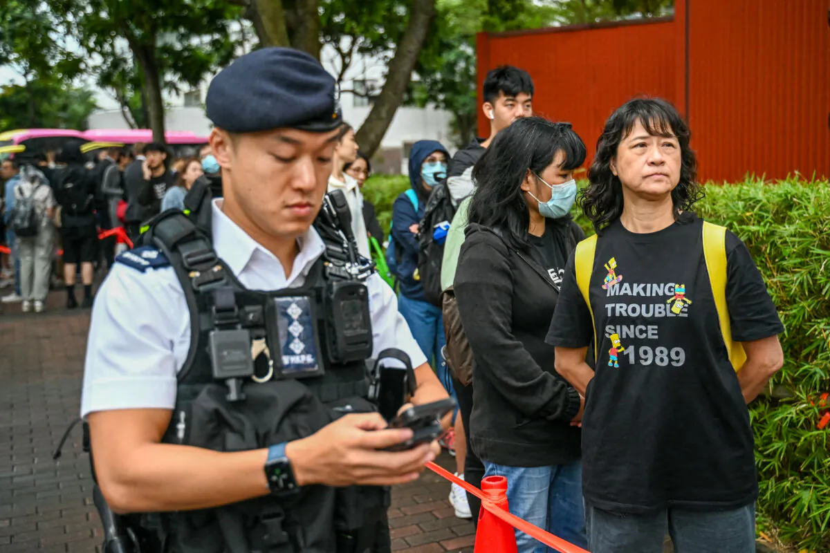 A queue forms outside the West Kowloon Magistrates' Court in Hong Kong on Nov. 19, 2024. (Peter Parks/AFP via Getty Images)