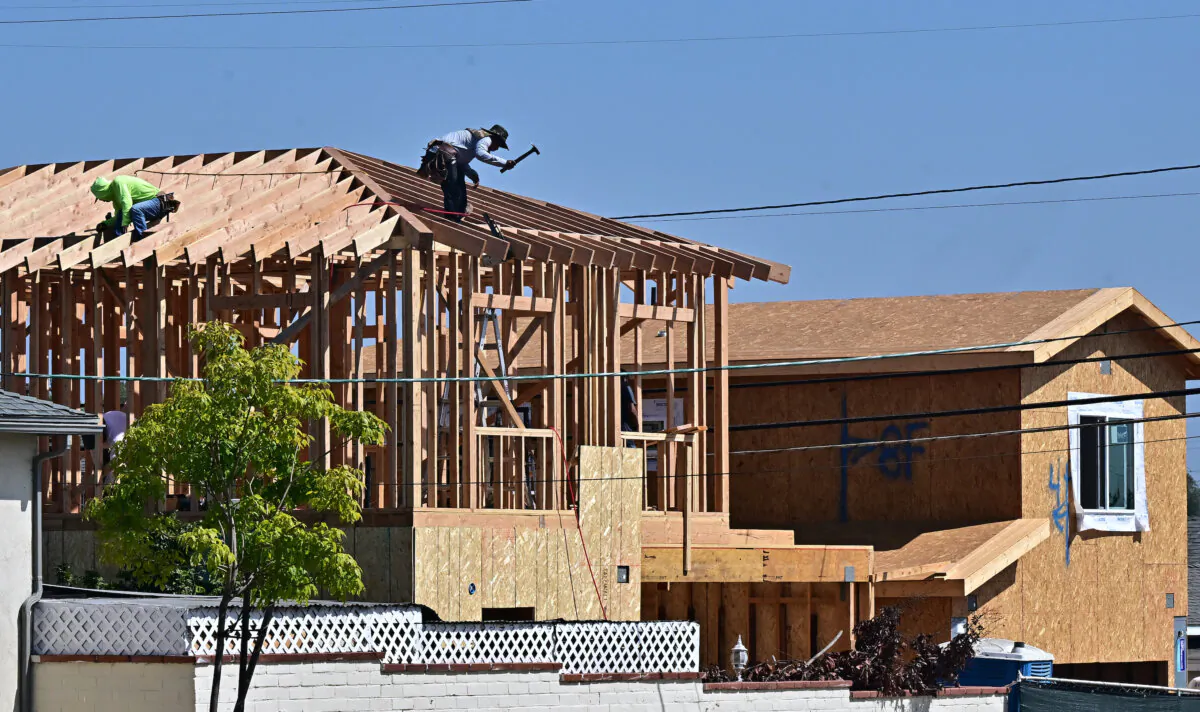 Construction workers work on the roof of a house being built in Alhambra, Calif., on Sept. 23, 2024. (Frederic J. Brown/AFP via Getty Images)