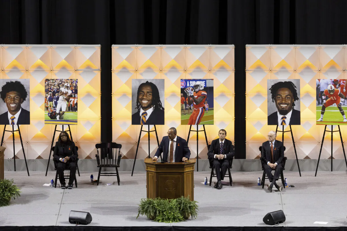 University of Virginia head football coach Tony Elliott speaks at a memorial service for Lavel Davis Jr., D’Sean Perry and Devin Chandler in Charlottesville, Va., Nov. 19, 2022. (Mike Kropf/The Daily Progress via AP)