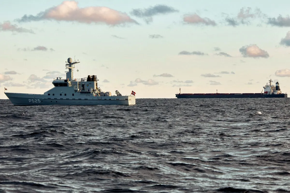 The Chinese ship, the bulk carrier Yi Peng 3 (right) is anchored and monitored by a Danish naval patrol vessels in the sea of Kattegat, near Jutland, Denmark, on Nov. 20, 2024. (Mikkel Berg Pedersen/Ritzau Scanpix/AFP via Getty Images)