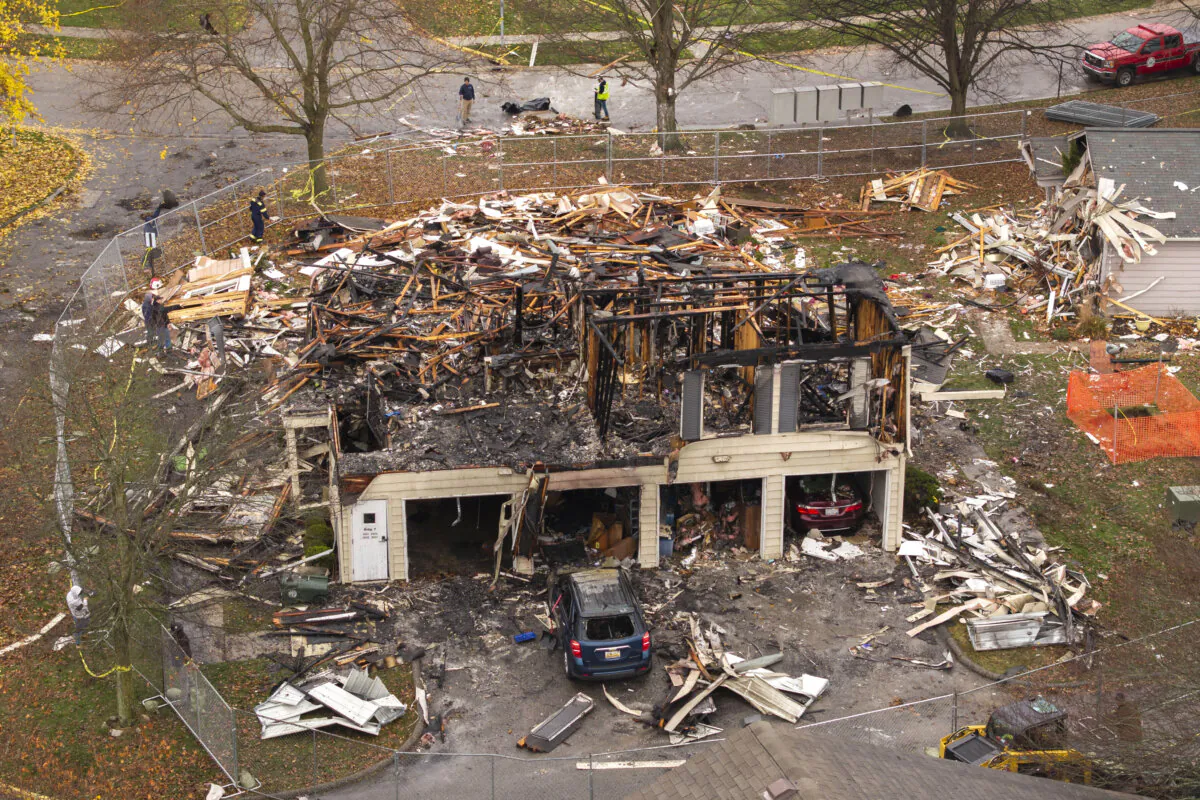 Debris from the aftermath of an explosion that destroyed a condominium at the Keatington New Town Association subdivision in Orion Township, Mich., on Nov. 20, 2024. (David Guralnick/Detroit News via AP)