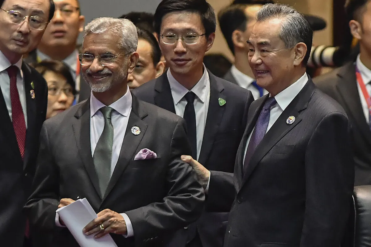 China's Foreign Minister Wang Yi (R) interacts with India's Minister of External Affairs Subrahmanyam Jaishankar (center L) during the 14th East Asia Summit Foreign Ministers' Meeting at the 57th Association of Southeast Asian Nations (ASEAN) Foreign Ministers' Meeting in Vientiane on July 27, 2024. The two leaders met again on the sidelines of the G20 summit in Brazil’s Rio de Janeiro on Nov. 18.(Sai Aung MAIN/AFP via Getty Images)