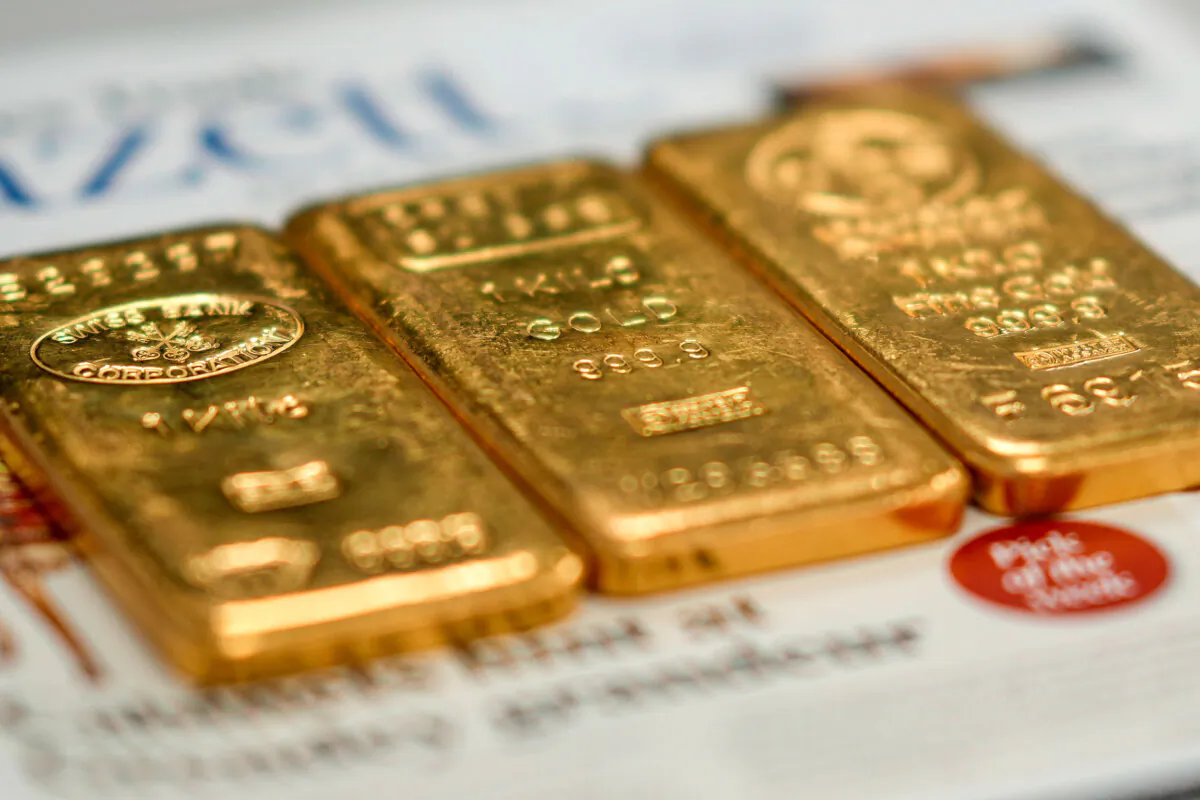 Three 1-kilogram gold bullion bars at a gold dealer's shop, in Birmingham, England, on Dec. 13, 2023. (Christopher Furlong/Getty Images)