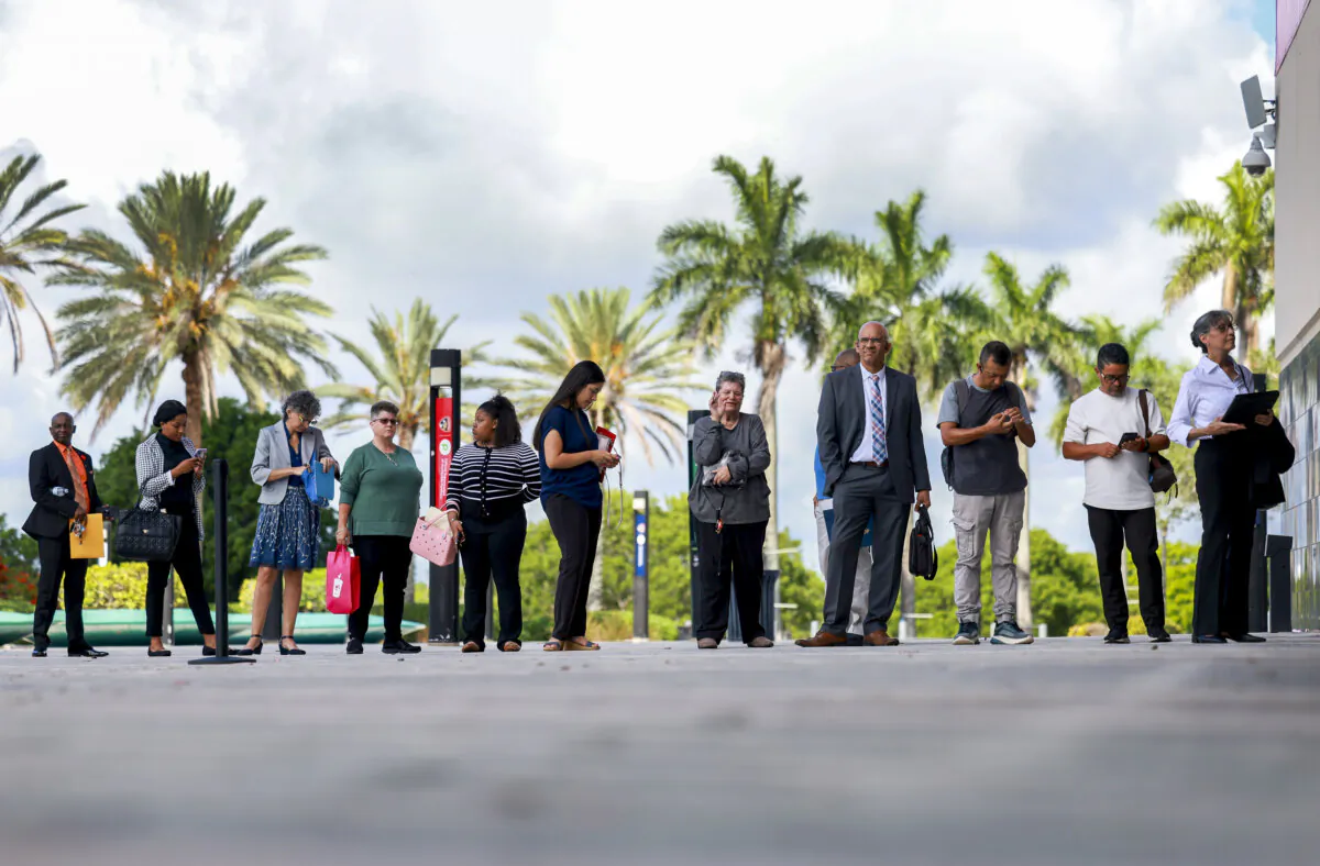 People line up as they wait for the JobNewsUSA.com South Florida Job Fair to open at the Amerant Bank Arena in Sunrise, Fla., on June 26, 2024. (Joe Raedle/Getty Images)