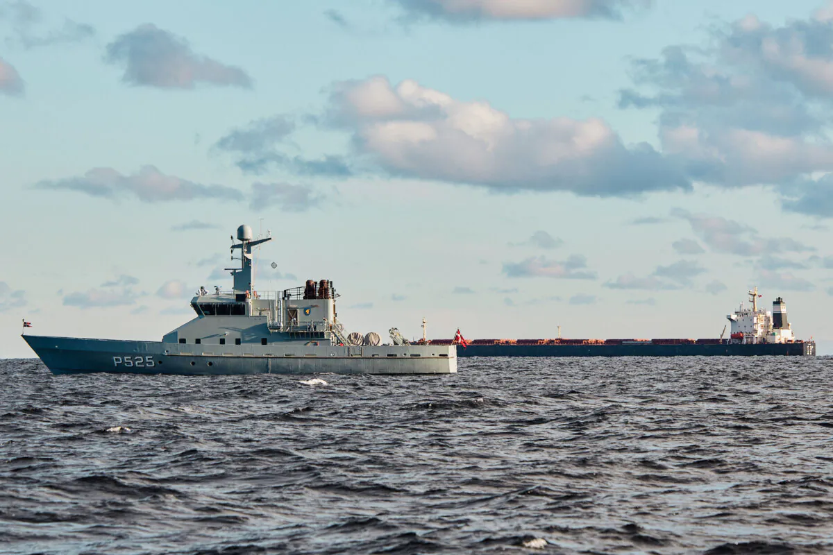 The Chinese bulk carrier Yi Peng 3, in background, is anchored and being monitored by Danish naval vessels in the sea of Kattegat, near the city of Granaa in Jutland, Denmark, on Nov. 20, 2024. (Mikkel Berg Pedersen/Ritzau Scanpix via AP)