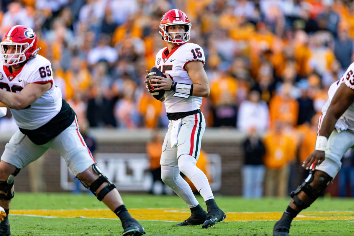Georgia quarterback Carson Beck (15) looks for a receiver during the first half of an NCAA college football game against Tennessee, Saturday, Nov. 18, 2023, in Knoxville, Tenn. (AP Photo/Wade Payne)