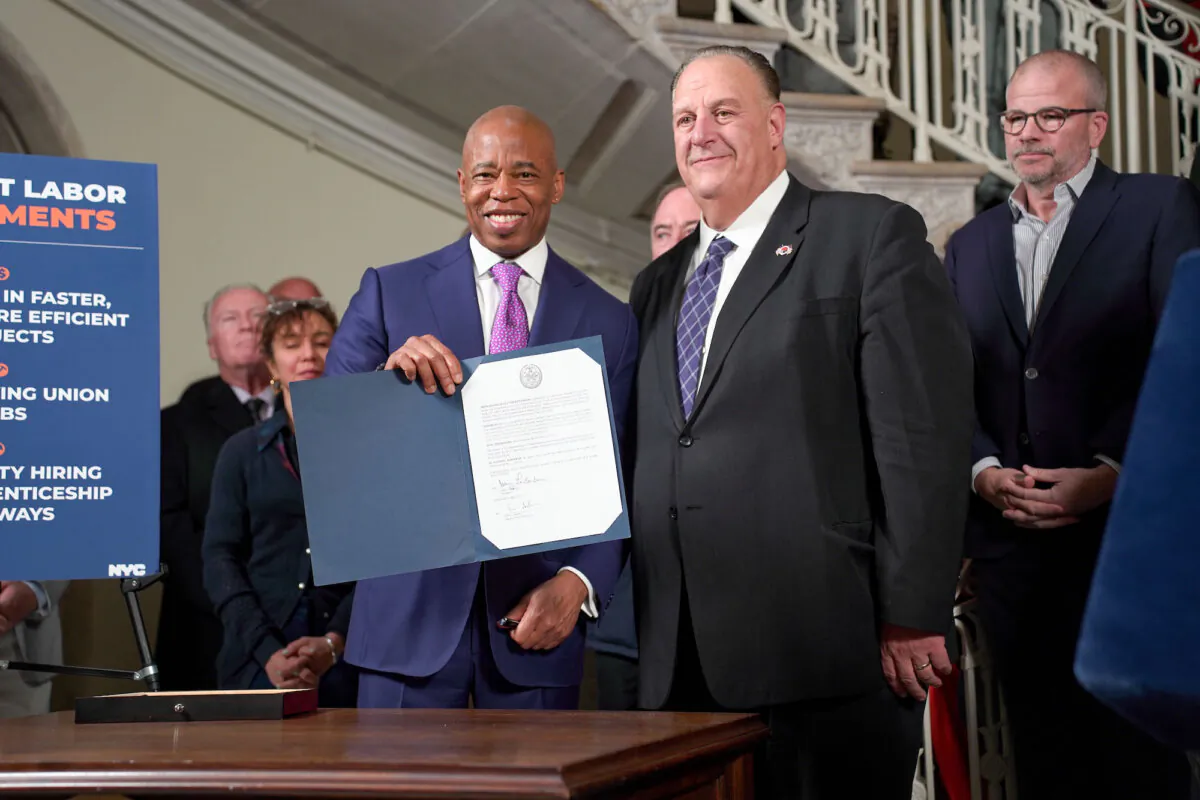 New York City Mayor Eric Adams (L) and BCTC President Gary LaBarbera (R) after announcing the Project Labor Agreements, at New York City Hall on Nov. 21, 2024. (Oliver Mantyk/Epoch Times)